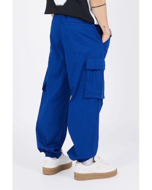 Pantalon cargo Champion pour homme en coloris Blue