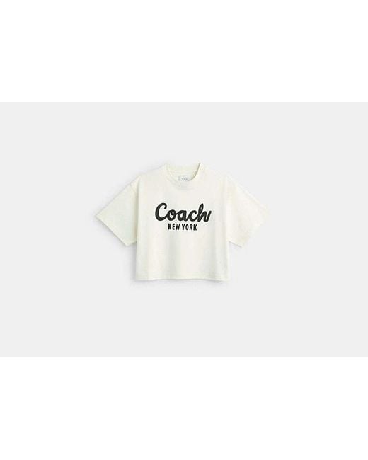 Camiseta corta de firma en cursiva COACH de color Black