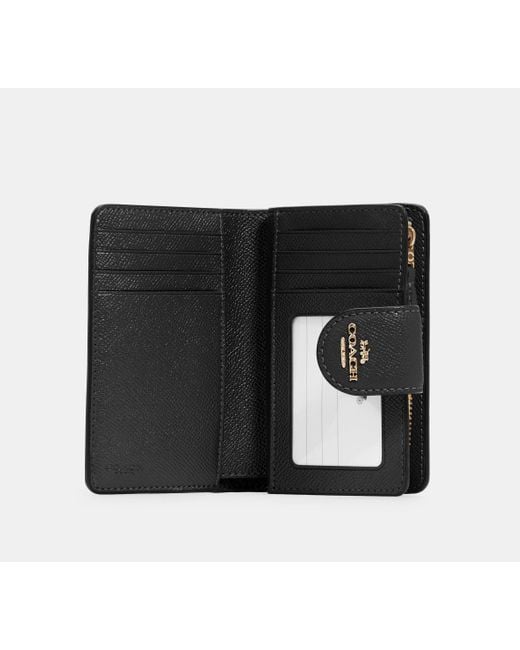 Medium Corner Zip Wallet di COACH in Black