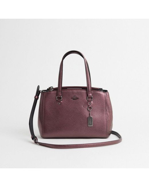 Coach charlie notenanalphabeten carryall with rivets