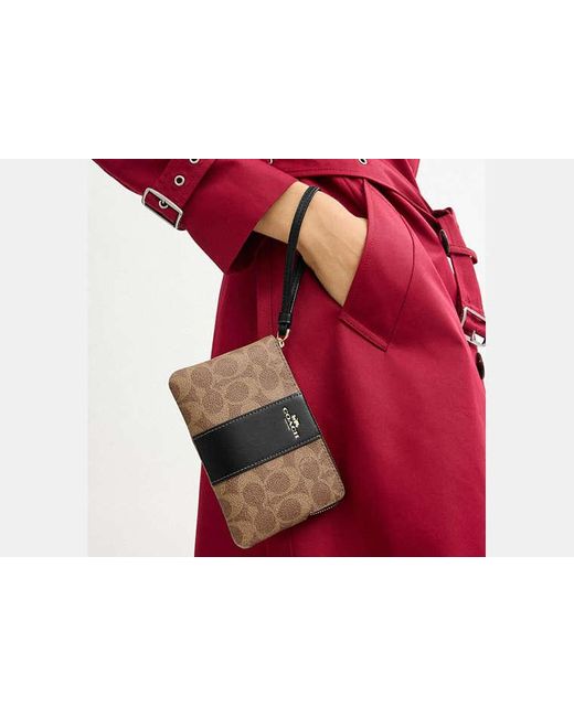 Bolso Pouch COACH de color Black