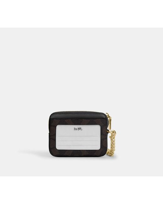 Tarjetero con cremallera en lona de firma COACH de color Black
