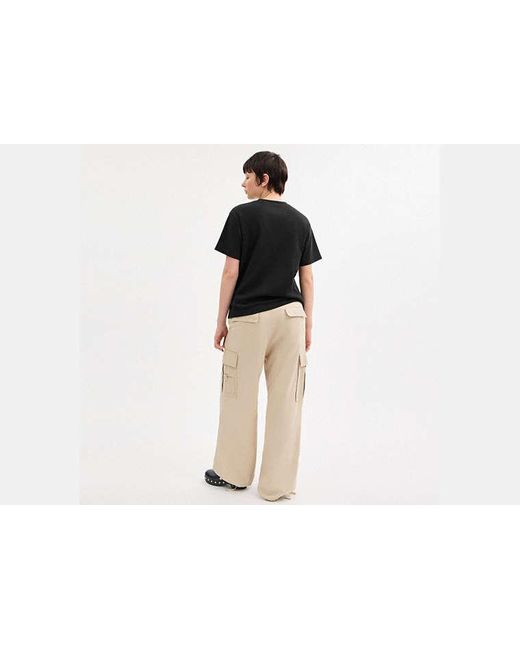 Haut COACH en coloris Black