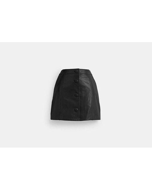 Minifalda de charol COACH de color Black
