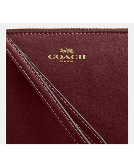 Bolso Pouch Con Cremallera Corner COACH de color Red