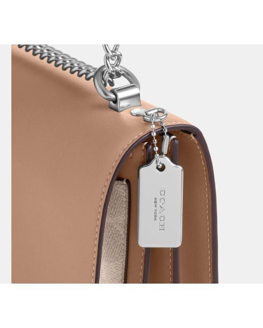 Bolso cruzado Klare de lona de firma COACH de color Black