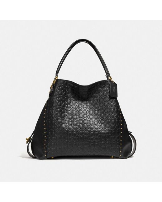 Edie shoulder bag 31 in signature canvas with rivets sale
