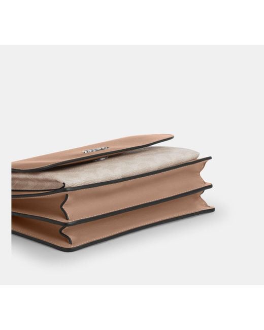 Bolso cruzado Klare de lona de firma COACH de color Black