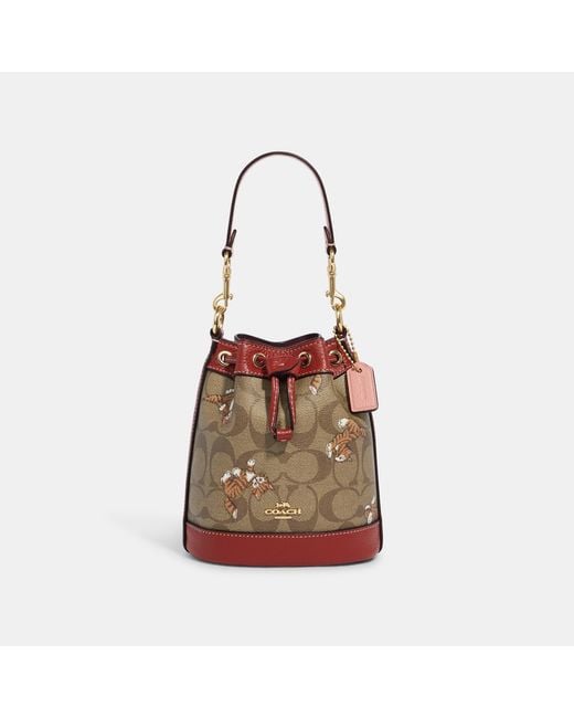 Coach Outlet Mini Dempsey Bucket Bag In Signature Canvas With Dancing ...
