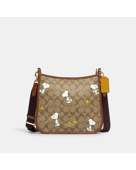 Coach Outlet Natural Coach X Peanuts Dempsey File Bag In Signature Canvas With Snoopy Woodstock Print