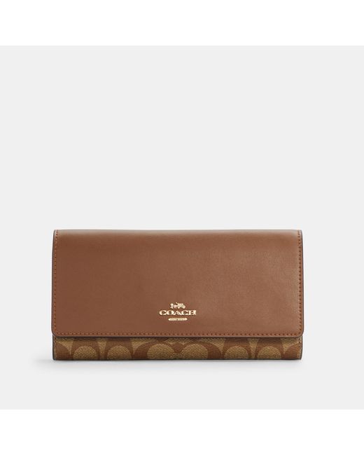 Coach Outlet Slim Trifold Wallet In Signature Canvas in Beige (Natural