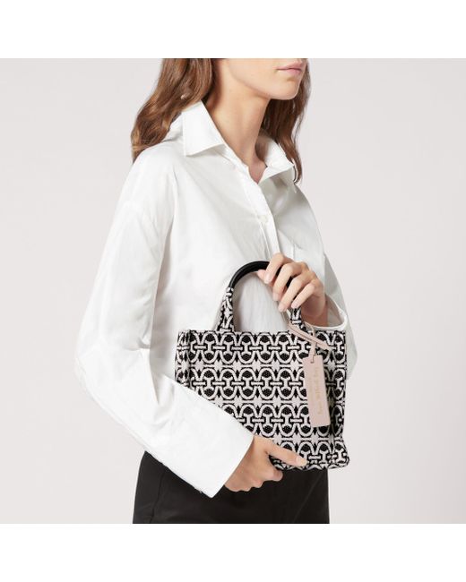 Coccinelle Black Handtasche aus Jacquard-Gewebe und genarbtem Leder Never Without Bag Monogram Small