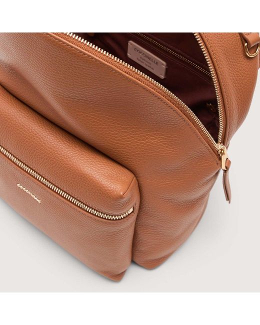coccinelle leather backpack Nory grained oyster The shoulder straps also feature an identity detail COCCINELLE Leather backpack | Hondos