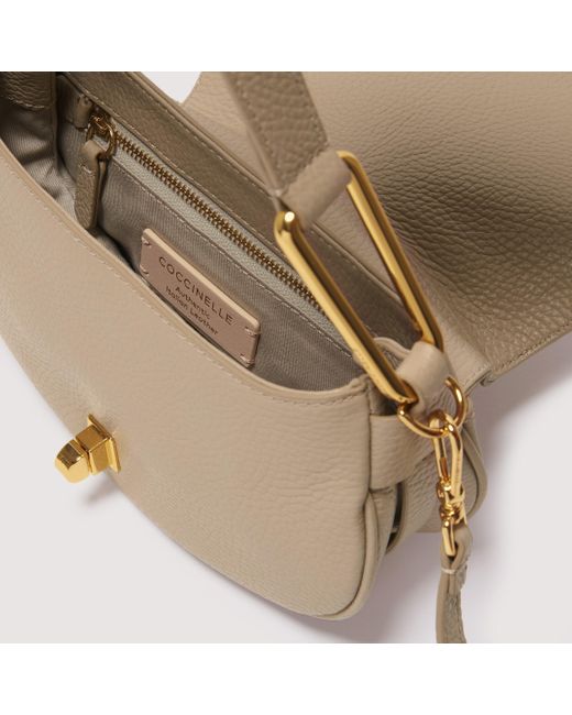 Coccinelle Grained Leather Handbag Magie Soft Mini in Natural | Lyst