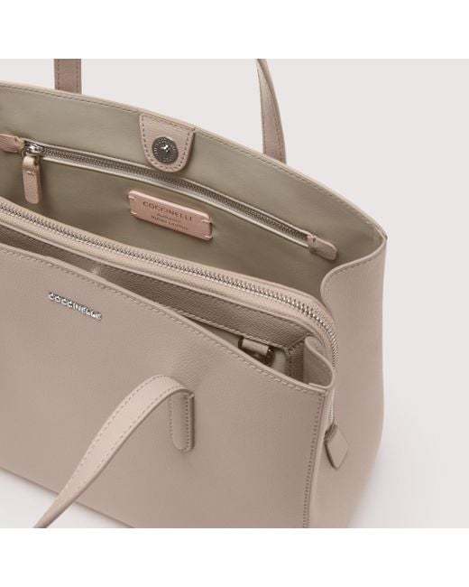 Coccinelle Saffiano Leather Handbag Swap Textured Medium in Natural | Lyst