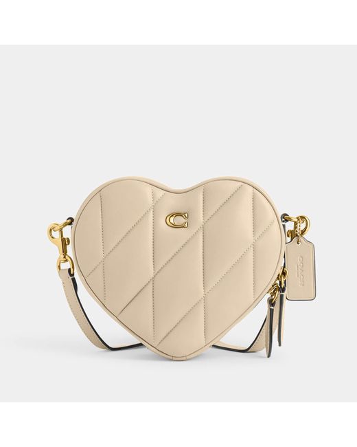 COMPARING THE ICONIC KATE SPADE AND COACH HEART CROSSBODY BAGS