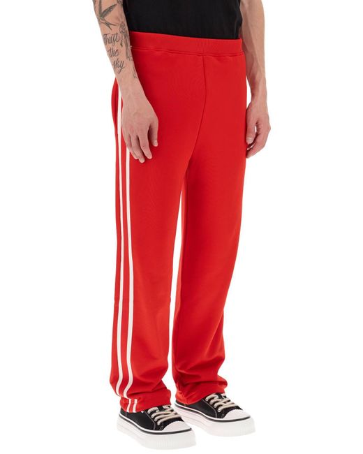 Pantaloni Sportivi Con Bande Laterali di AMI in Red da Uomo