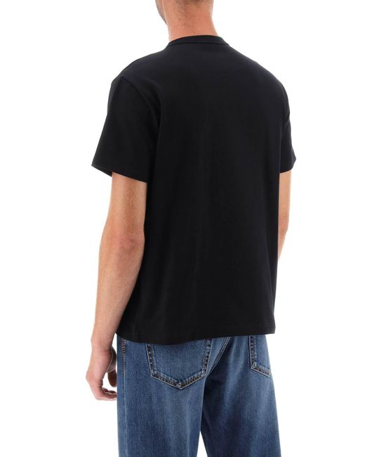 T-shirt con stampa teschio e logo varsity di Alexander McQueen in Black da Uomo