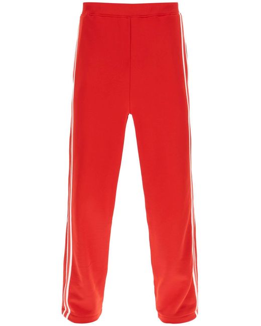 Pantaloni Sportivi Con Bande Laterali di AMI in Red da Uomo