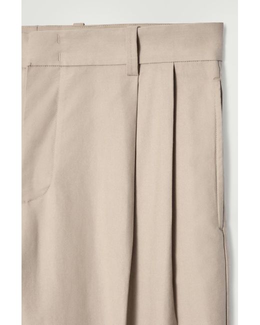 COS Natural Relaxed Pleated Cotton Tapered Trousers