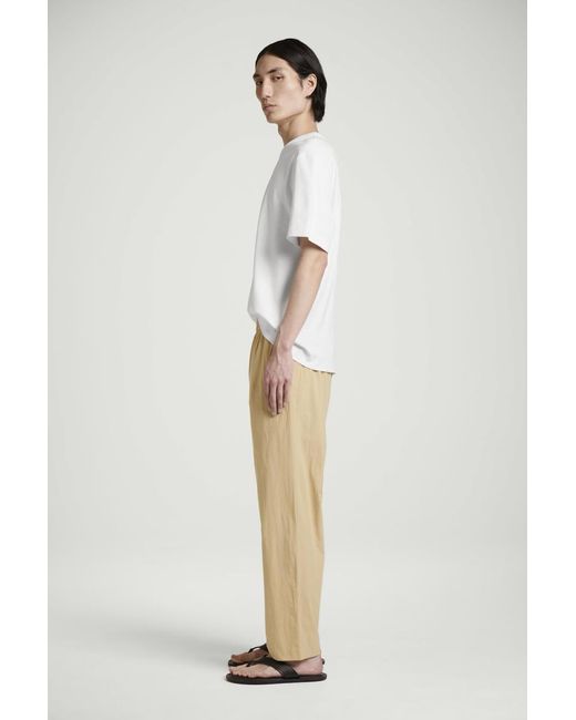 COS Natural Elasticated Cotton Regular-Fit Tapered Trousers for men