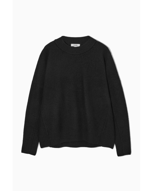 COS Dropped-shoulder Boiled-wool Sweater in Black | Lyst