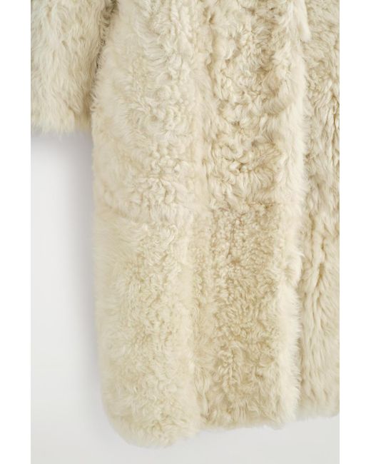 COS Natural Collarless Shearling Long Coat