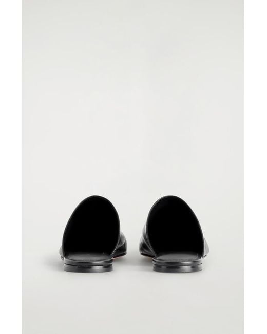 Mules di COS in Black