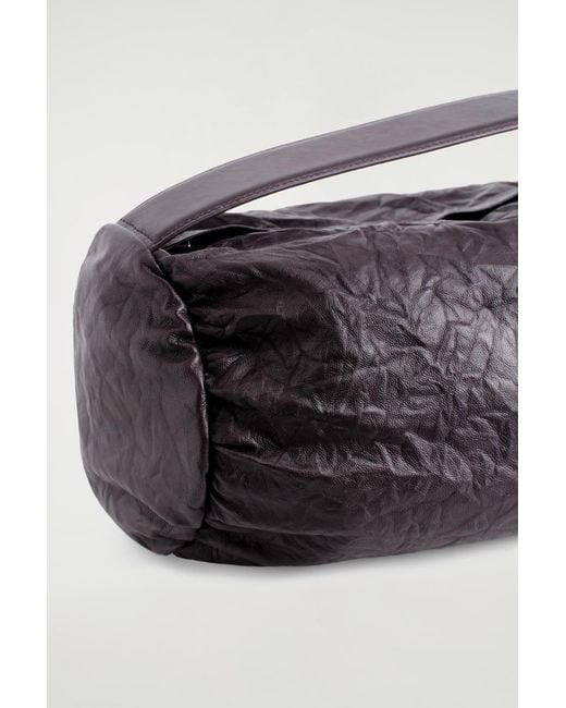 COS Brown Cylinder Clutch Bag