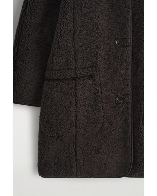 Giacca Teddy Lunga di COS in Black