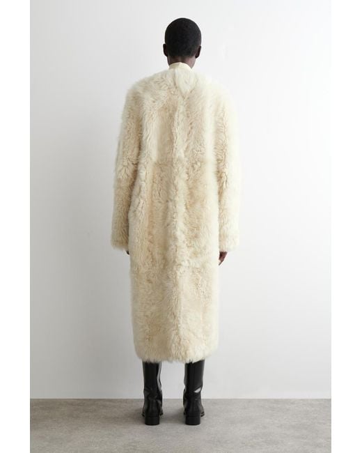 COS Natural Collarless Shearling Long Coat