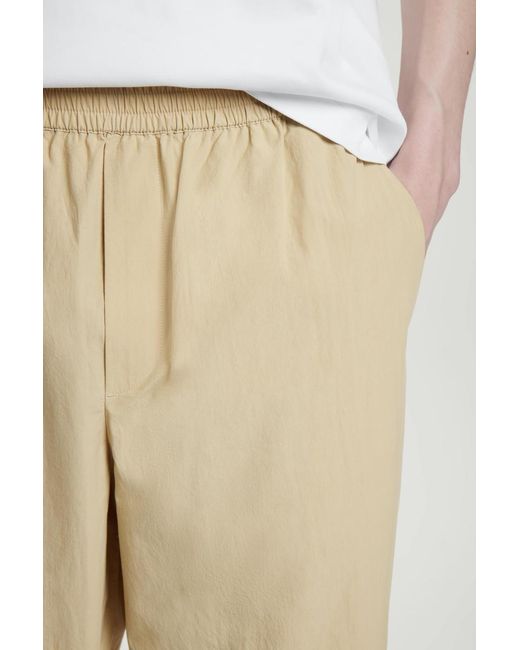 COS Natural Elasticated Cotton Regular-Fit Tapered Trousers for men