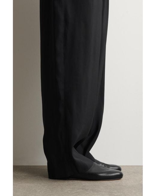 Mules di COS in Black