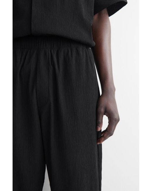 COS Black Crinkled-Cotton Relaxed-Fit Tapered Pants for men