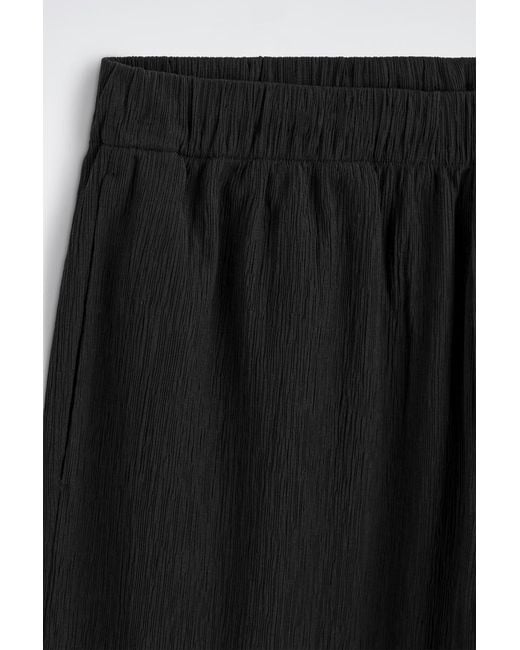 COS Black Crinkled-Cotton Relaxed-Fit Tapered Pants for men