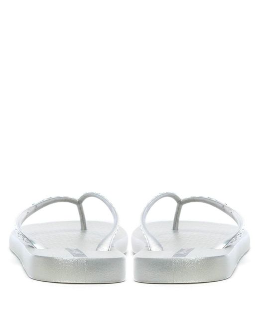 metallic silver flip flops