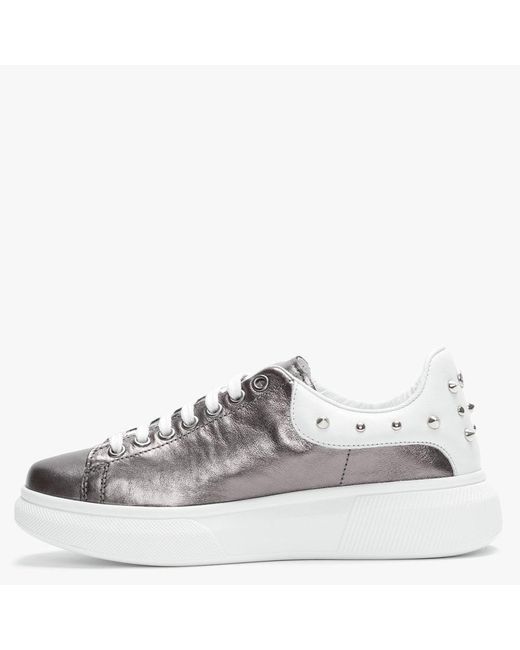 studded white trainers