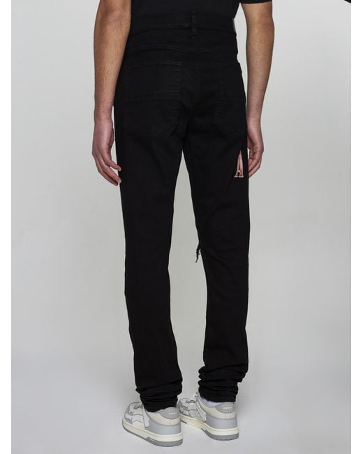 Amiri Black Tie-dye Logo Skinny Jeans for men