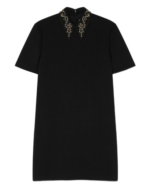 Miniabito in crêpe di lana con borchie di Versace in Black