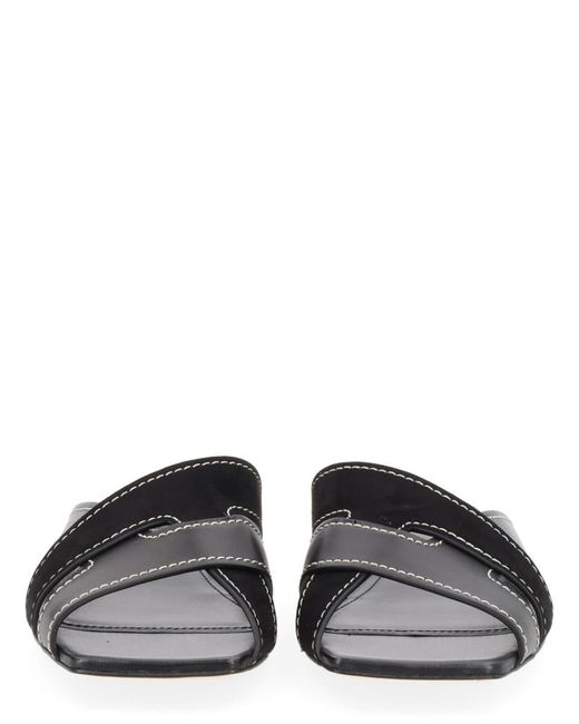 Tod's Black Solid Cross-Strap Flats