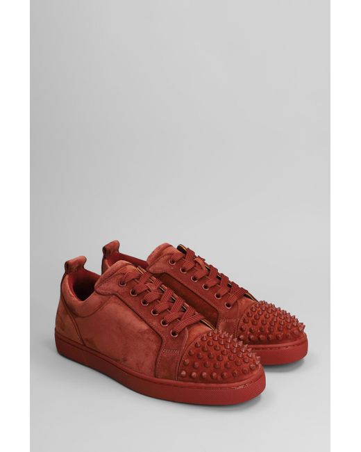 Sneakers Louis junior spikes in Camoscio Rosso di Christian Louboutin in Red da Uomo