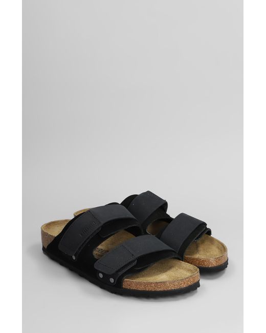 Sandali flats Uji in Camoscio Nero di Birkenstock in Black