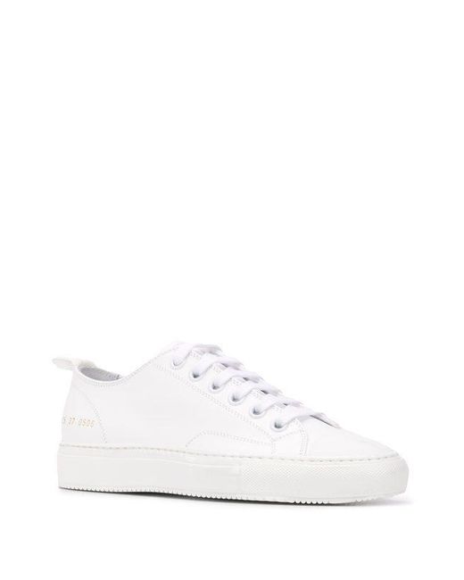 white sneakers common projects
