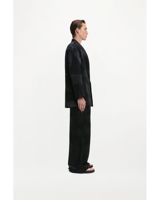 delos.land Black Clement Trousers Monogram for men