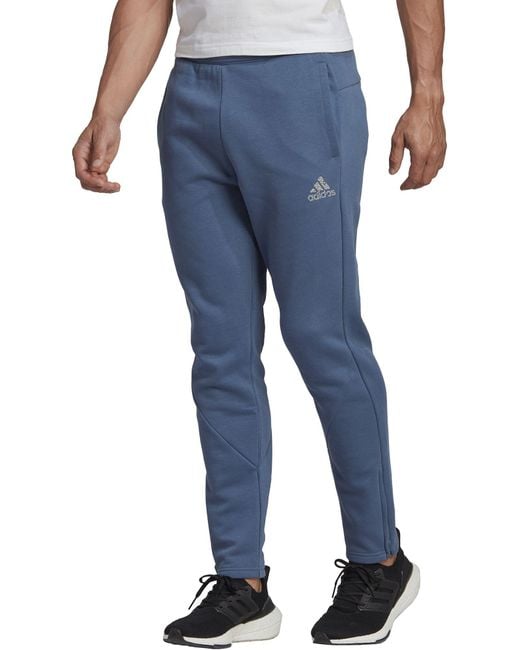 adidas Stadium Fleece Recycled Badge Of Sport Tapered Pants in Blue for ...
