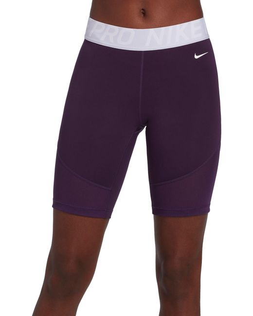 purple nike football shorts