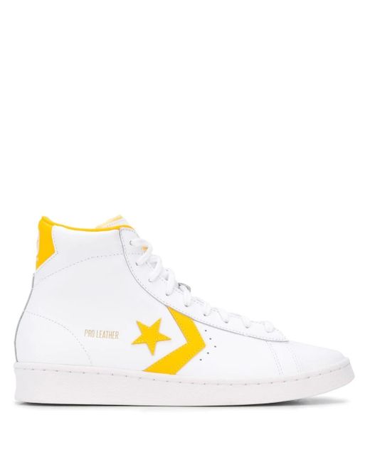 yellow and white converse