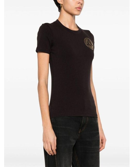 | T-shirt in cotone stretch con logo frontale | female | NERO | S di Versace in Black