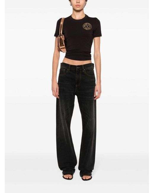| T-shirt in cotone stretch con logo frontale | female | NERO | S di Versace in Black