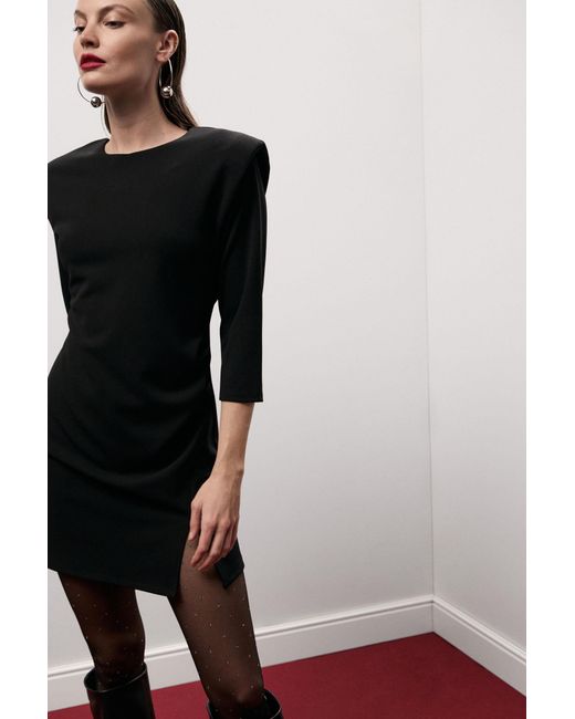 Robe Courte Épaules Structurées Pli Côté Dixie en coloris Black